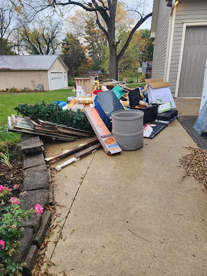 Dumpster being loaded with debris for 10 Yard Dumpster Rental in Franklin Park